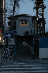 A softly lit construction sign with gentle evening light, symbolizing progress and patience.