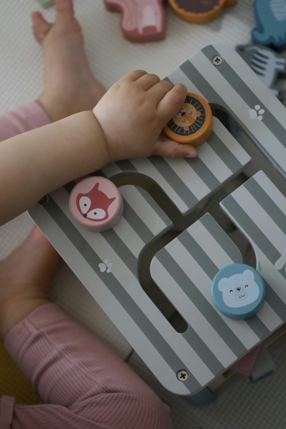 a child playing with a toy on a table