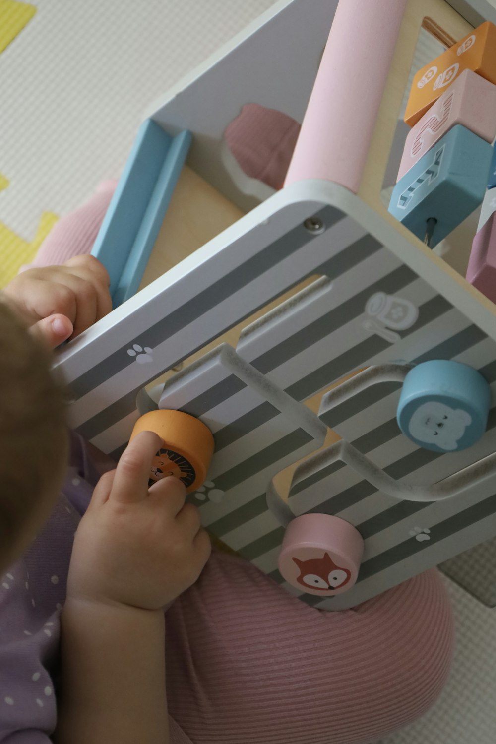 a child playing with a toy in a room