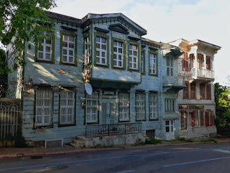 Before and after comparison of a neglected old house transformed into a warm living space.