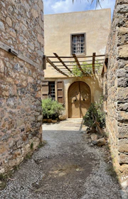 A sturdy stone walkway leading to a cozy cottage, showcasing expert tile and stone work.
