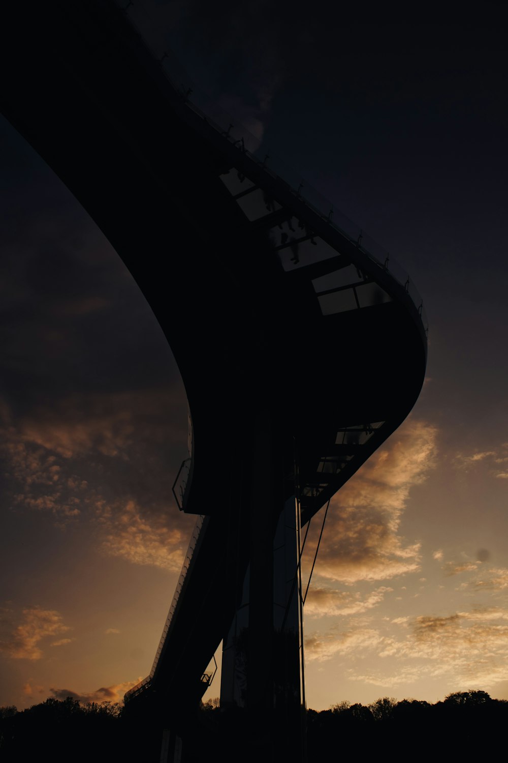 a very tall building with a sky in the background