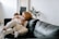 A warm and inviting scene of a mother reading a book with her child in a cozy living room.