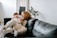 A mother reading a book with her child in a cozy living room.
