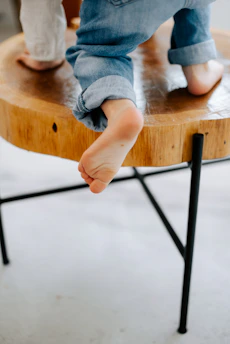 a person standing on top of a wooden table