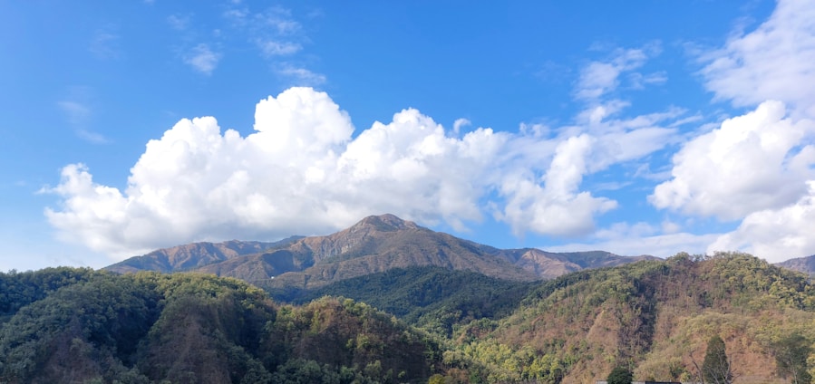 A scenic view of Huancabamba's lush green hills under a bright blue sky.