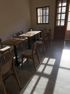 Warm sunlight streaming through the ilios cafe windows onto guests enjoying fresh dishes