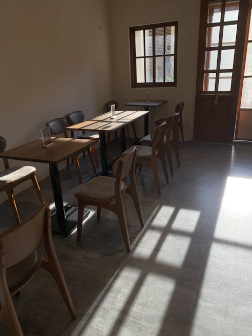 Warm sunlight streaming through the ilios cafe windows onto guests enjoying fresh dishes