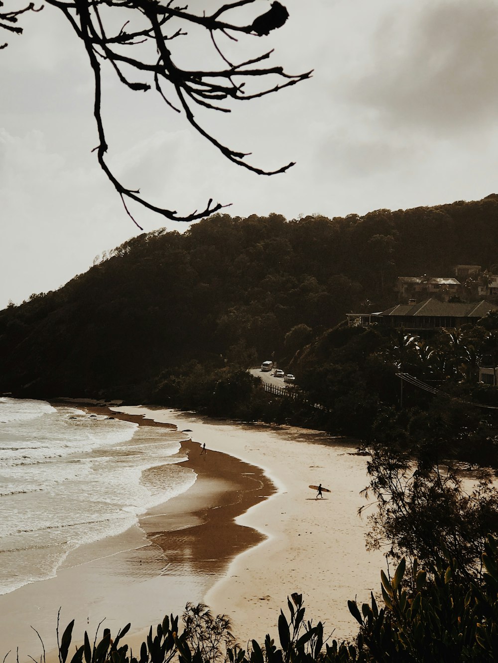 a view of a beach with a person in the water