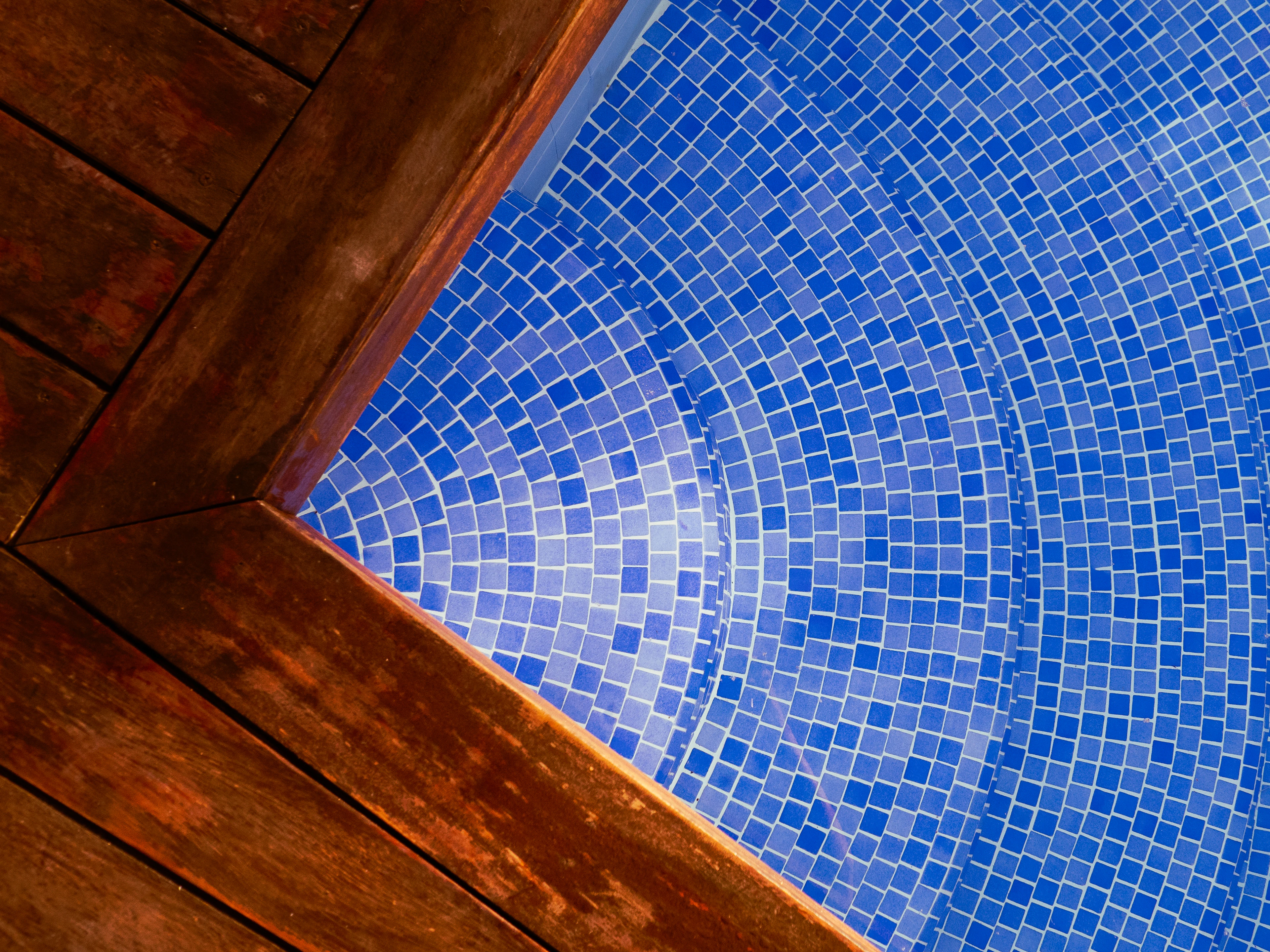 Swimming pool with a wooden deck