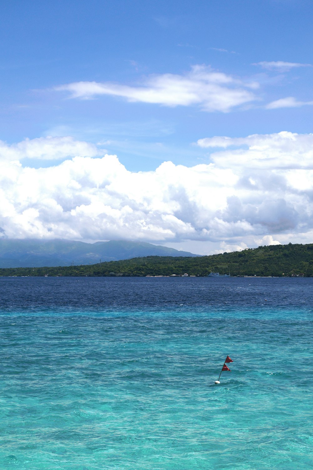 a person riding a surfboard on a body of water