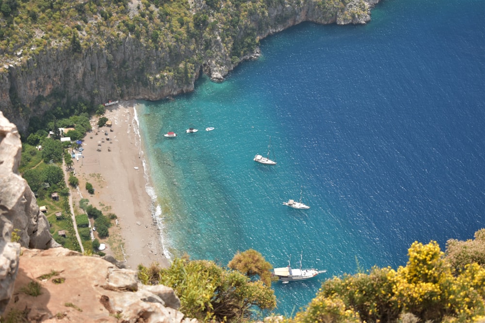 a view of a beach with boats in the water