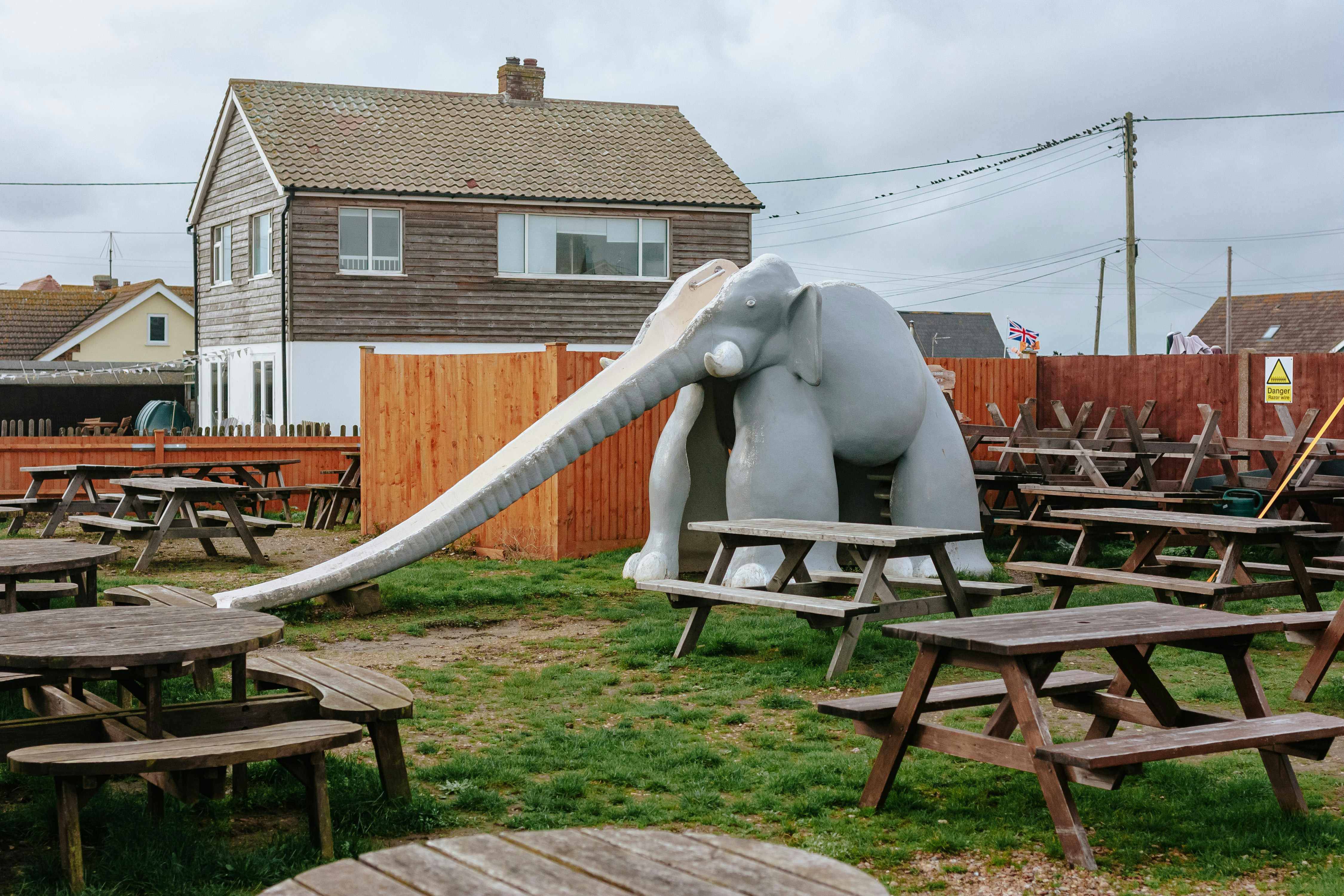 an elephant sculpture sitting on top of a wooden table