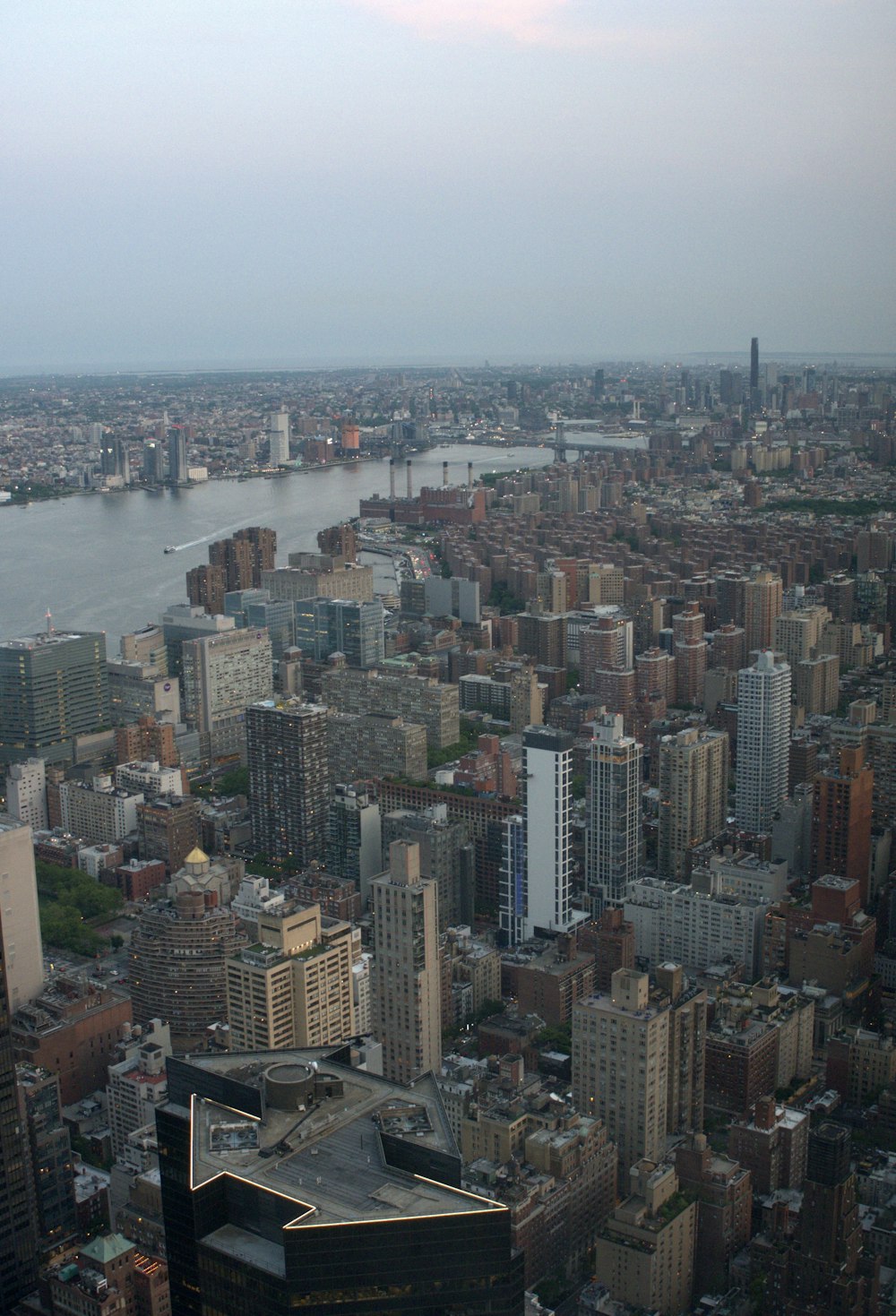 an aerial view of a city with tall buildings