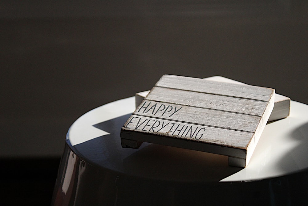 a wooden sign that says happy everything on it