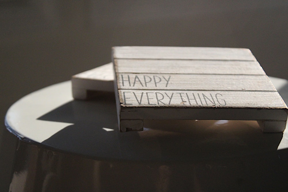 a piece of wood that says happy everything on it