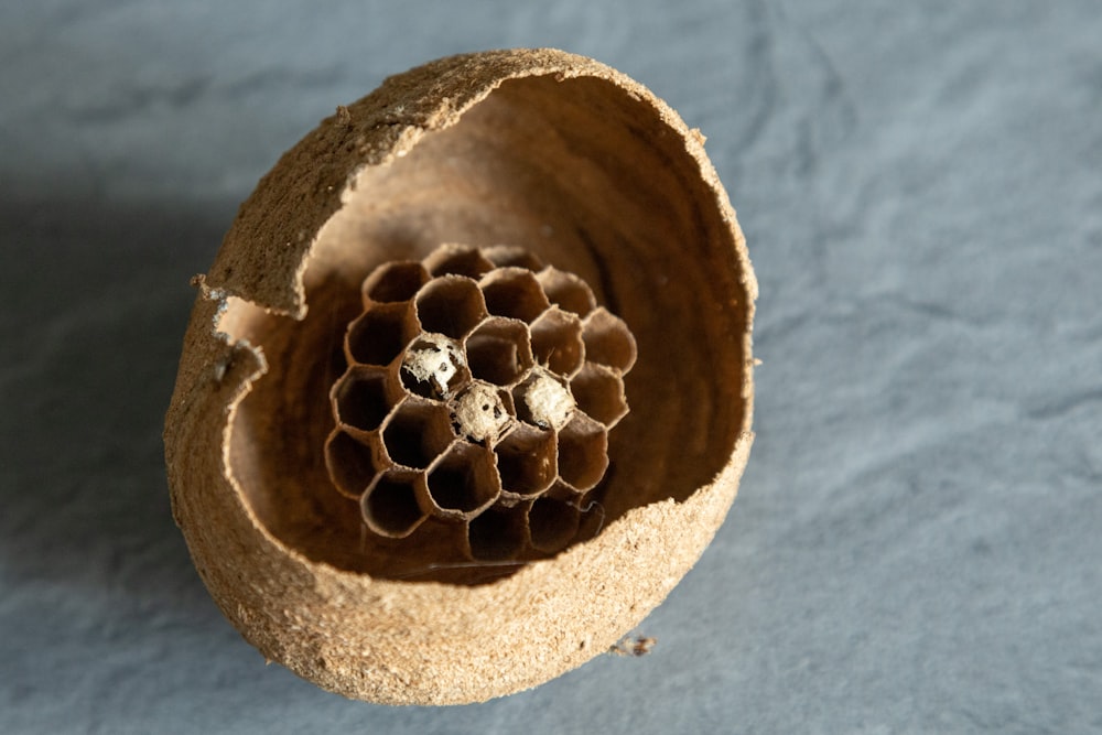 a close up of a wooden object on a table