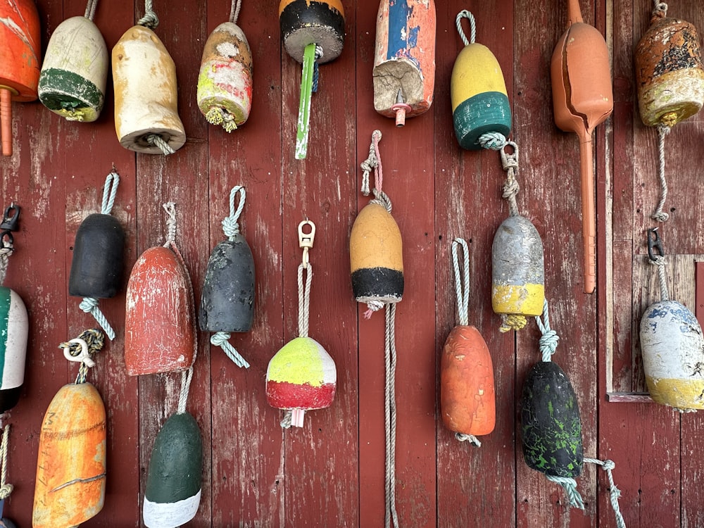 a bunch of buoys hanging on a wall