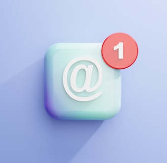 a white square with an "at" sign and a red circle with a "1" like email notifications