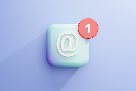 a white square with an "at" sign and a red circle with a "1" like email notifications