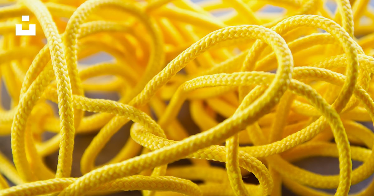 A bunch of yellow ropes on a table photo – Free Rope Image on Unsplash