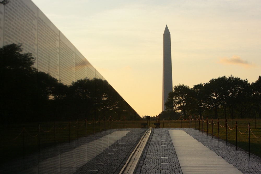 a reflection of the washington monument in a glass window