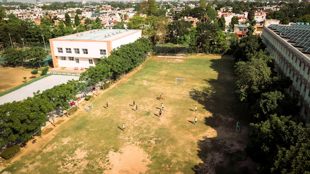 a group of people playing soccer in a field