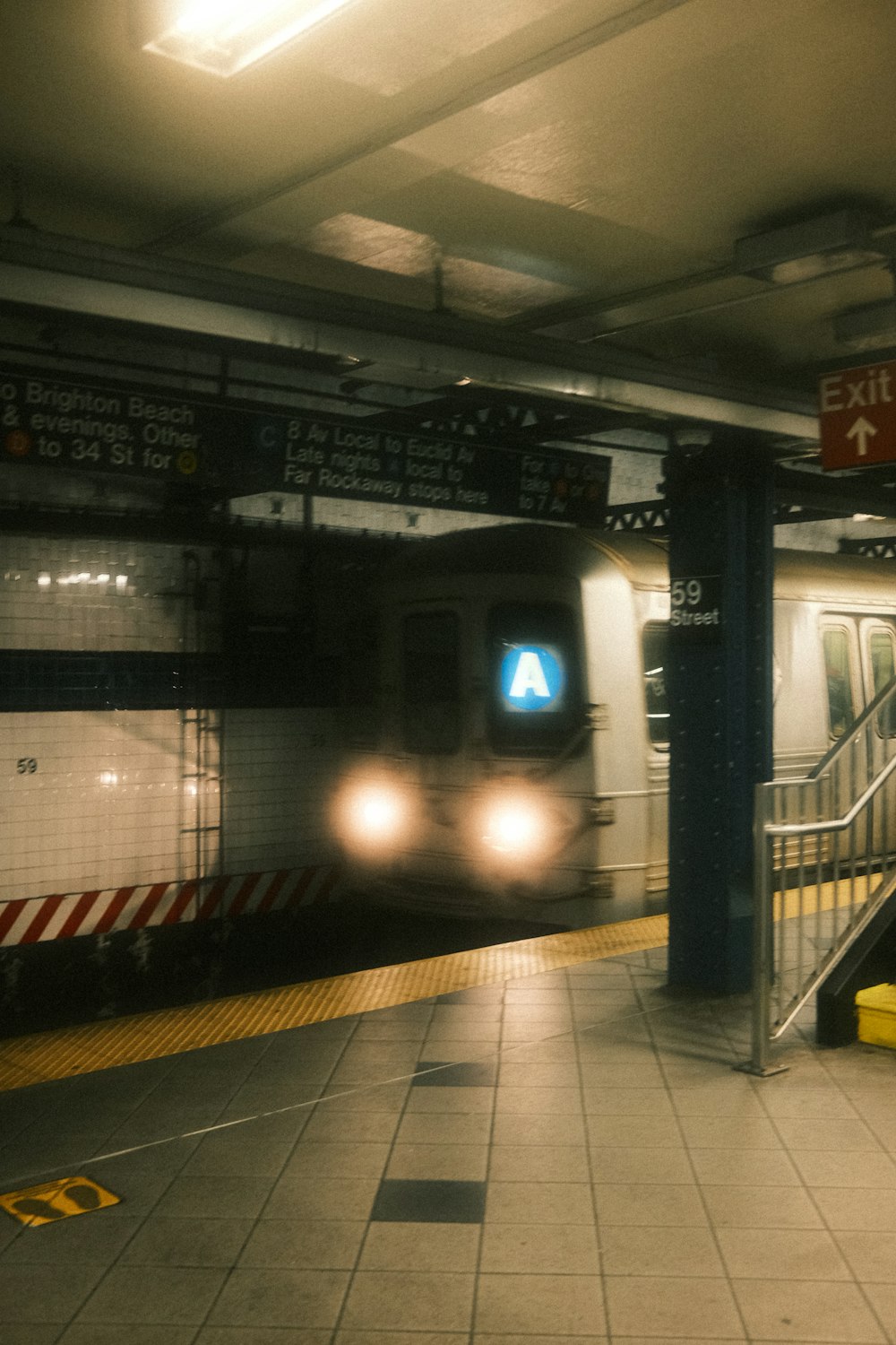 a subway train pulling into a subway station