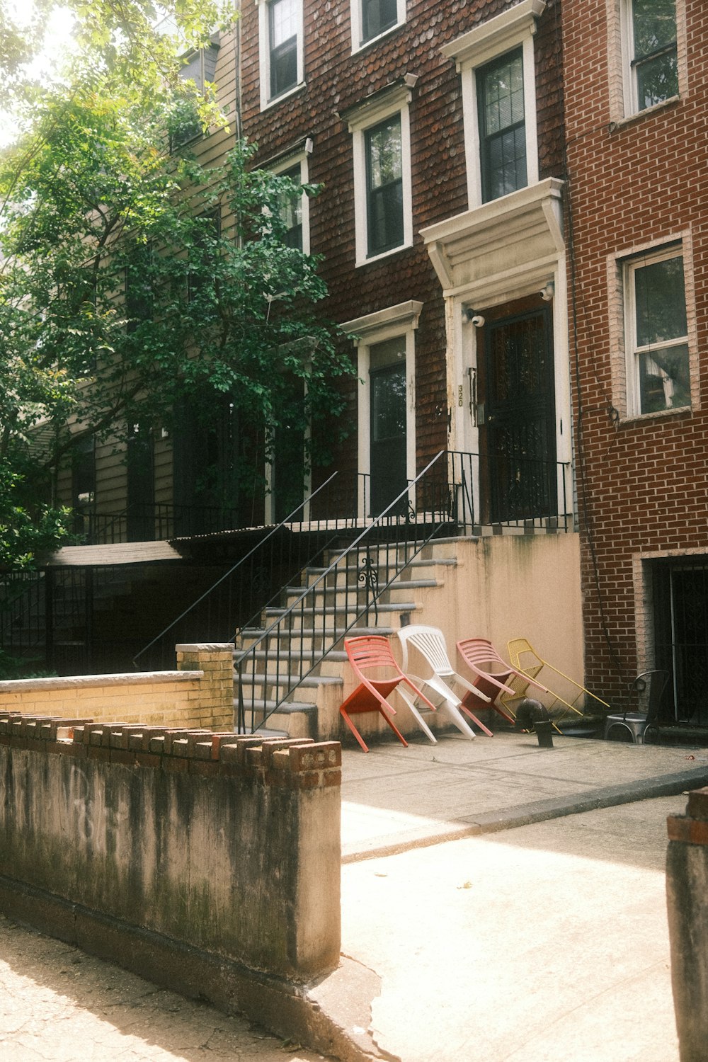 a group of lawn chairs sitting in front of a building