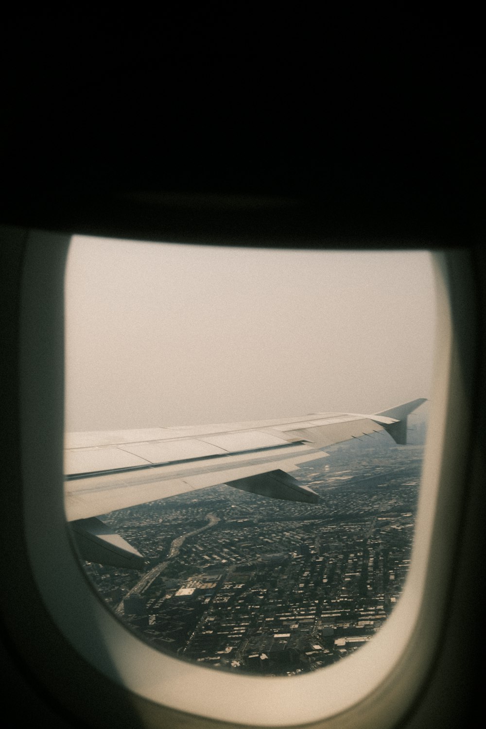 a view of a city from an airplane window