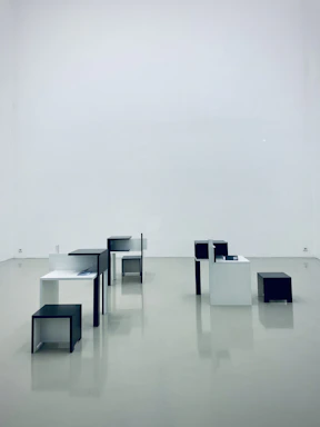 Compact modular pop-up furniture set arranged stylishly in a minimalist apartment space.
