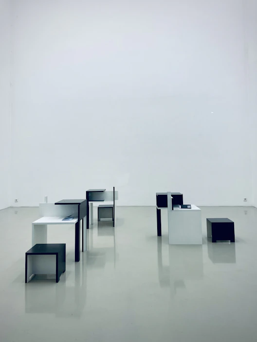 Compact modular pop-up furniture set arranged stylishly in a minimalist apartment space.