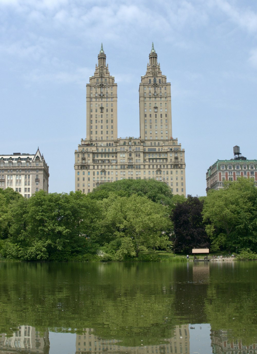 a view of a large building across a lake