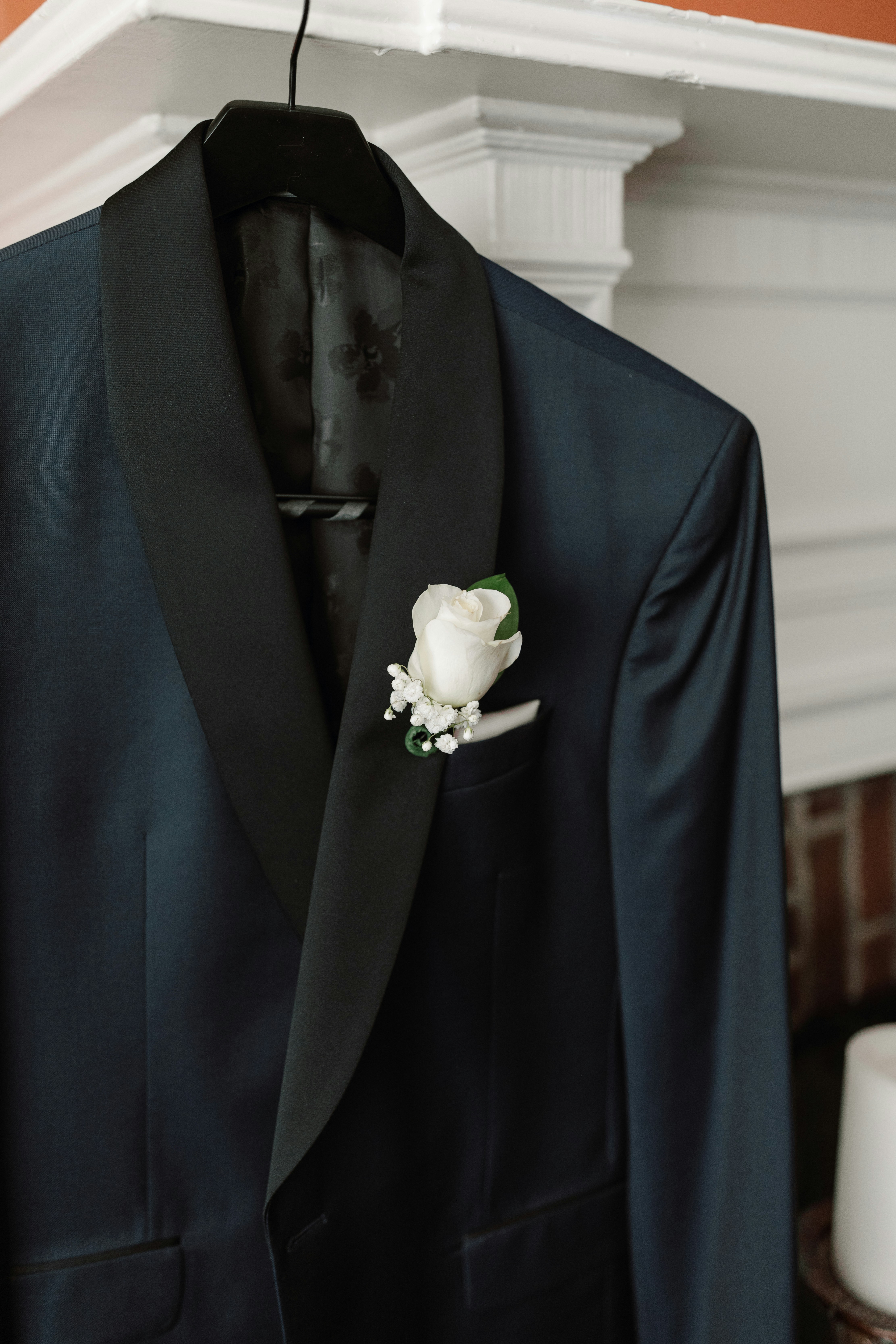 A black suit with a white flower on it photo – Free Usa Image on Unsplash