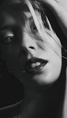 Black-and-white close-up of the band’s lead singer with dramatic shadow play reminiscent of classic gothic portraits.