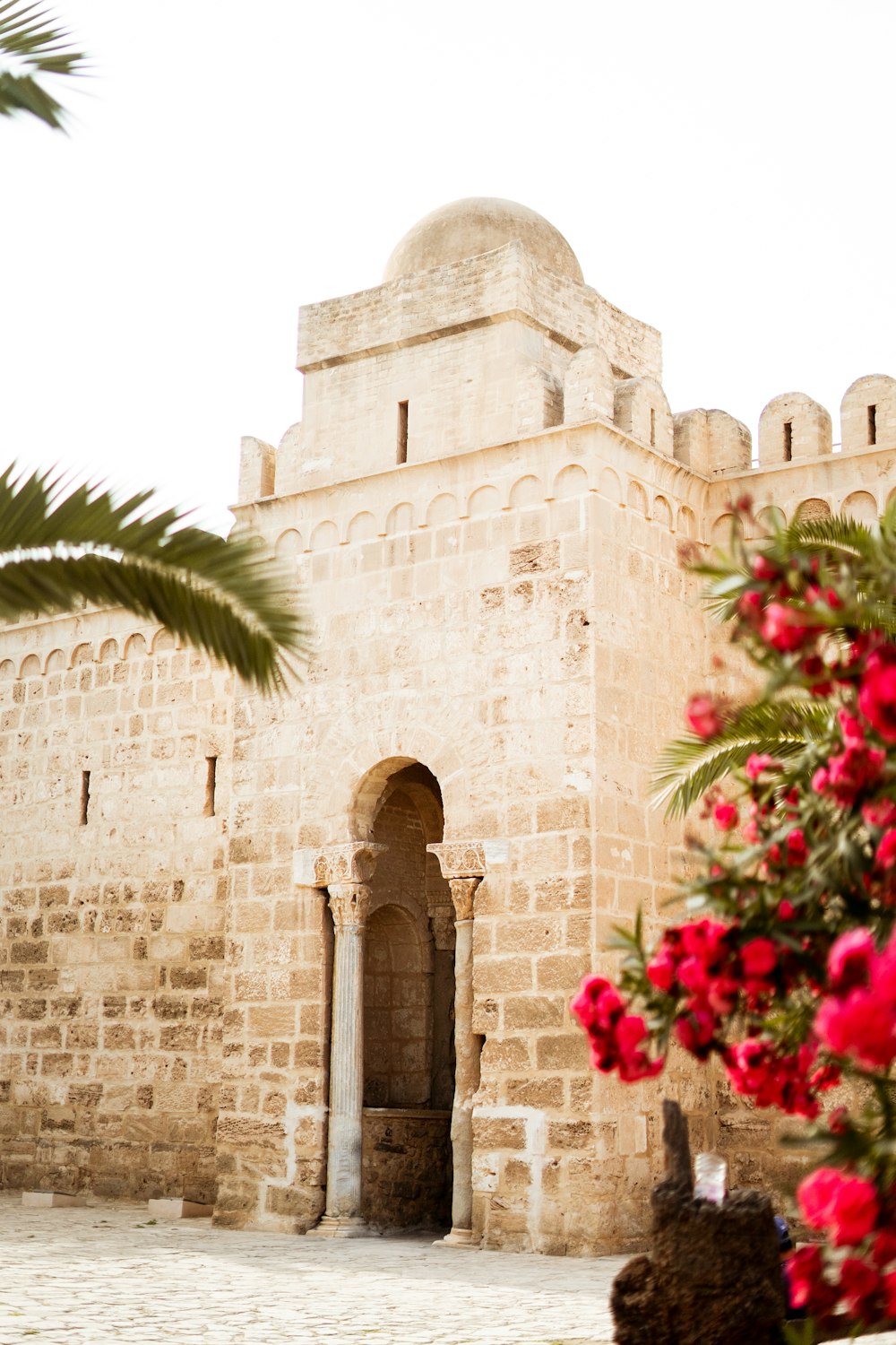 a stone building with a white dome on top of it