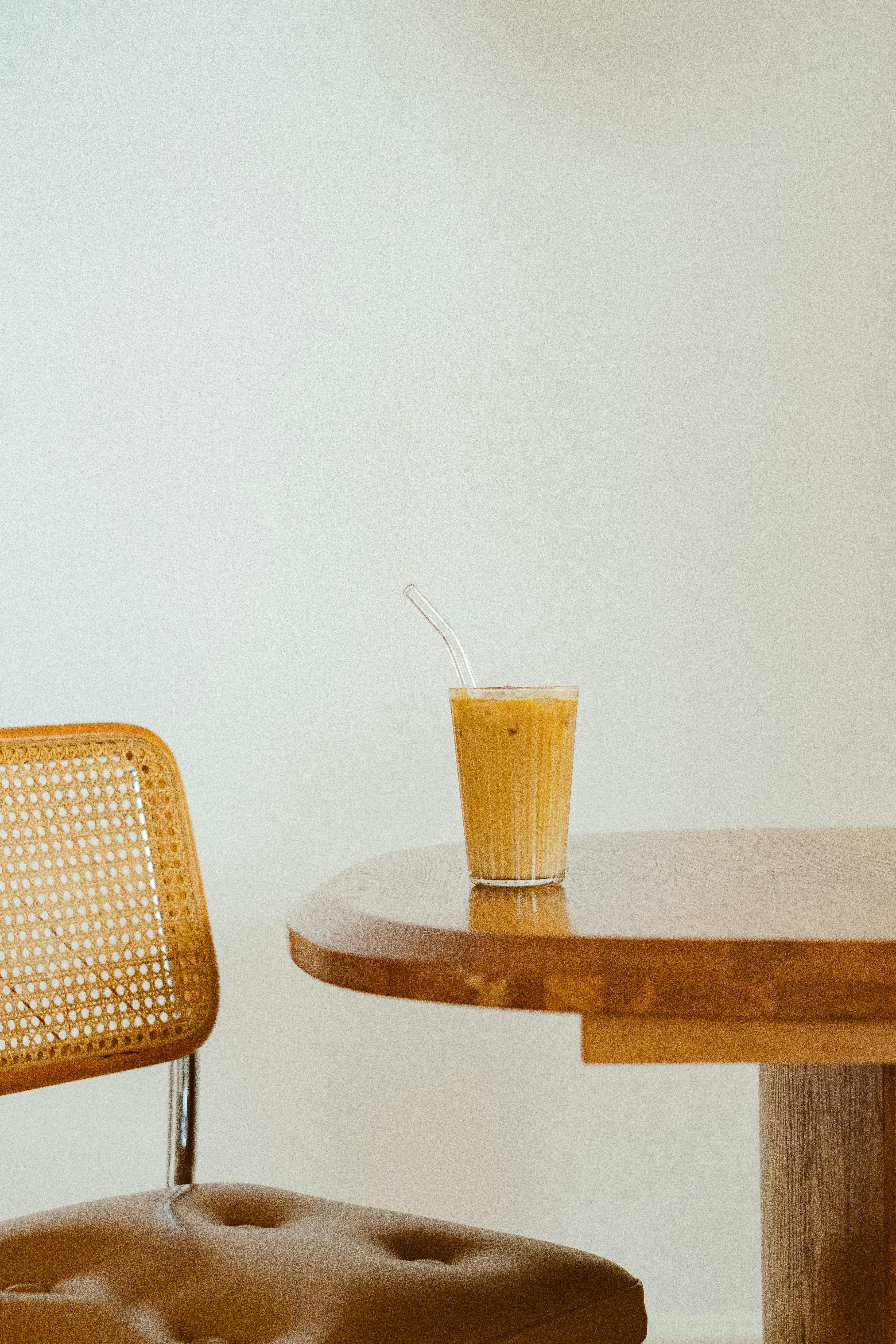 A chair and a table with a drink on it photo Free One Image on Unsplash