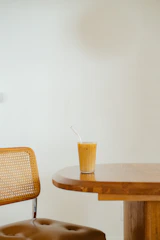 Shot of a minimalist wooden coffee table placed in a bright living room.