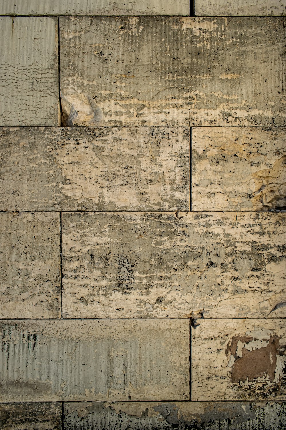 a close up of a wooden wall with peeling paint