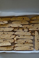 A colorful assortment of biscotti and cantucci displayed in a charming ceramic bowl.