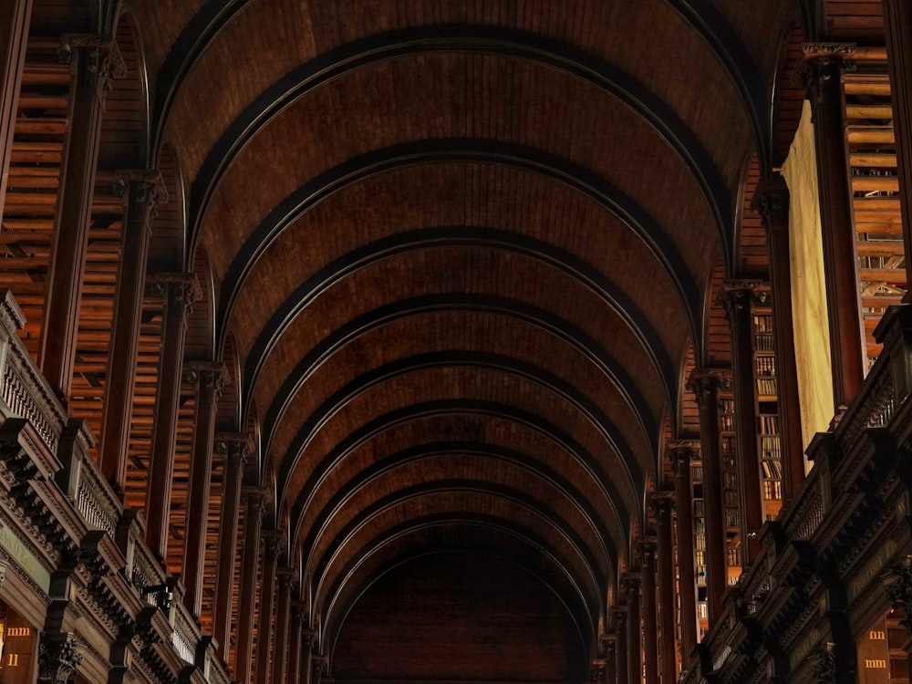 a very long room with a bunch of books on the shelves
