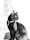 A sleek black cat lounging on a windowsill wearing a green collar with a small bell.