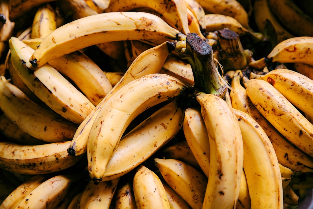 a bunch of ripe bananas sitting on top of a table