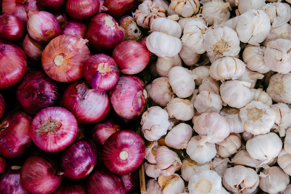 a pile of garlic next to a pile of garlic