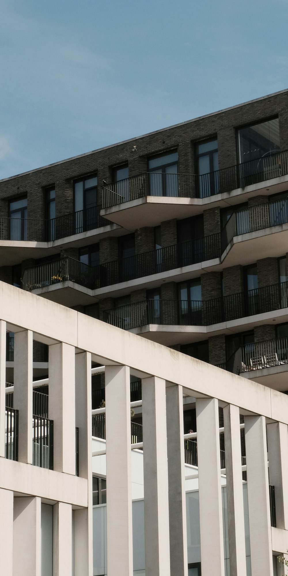 a tall building with balconies and balconies on top of it