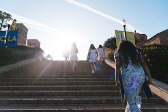 a group of people walking down a flight of stairs