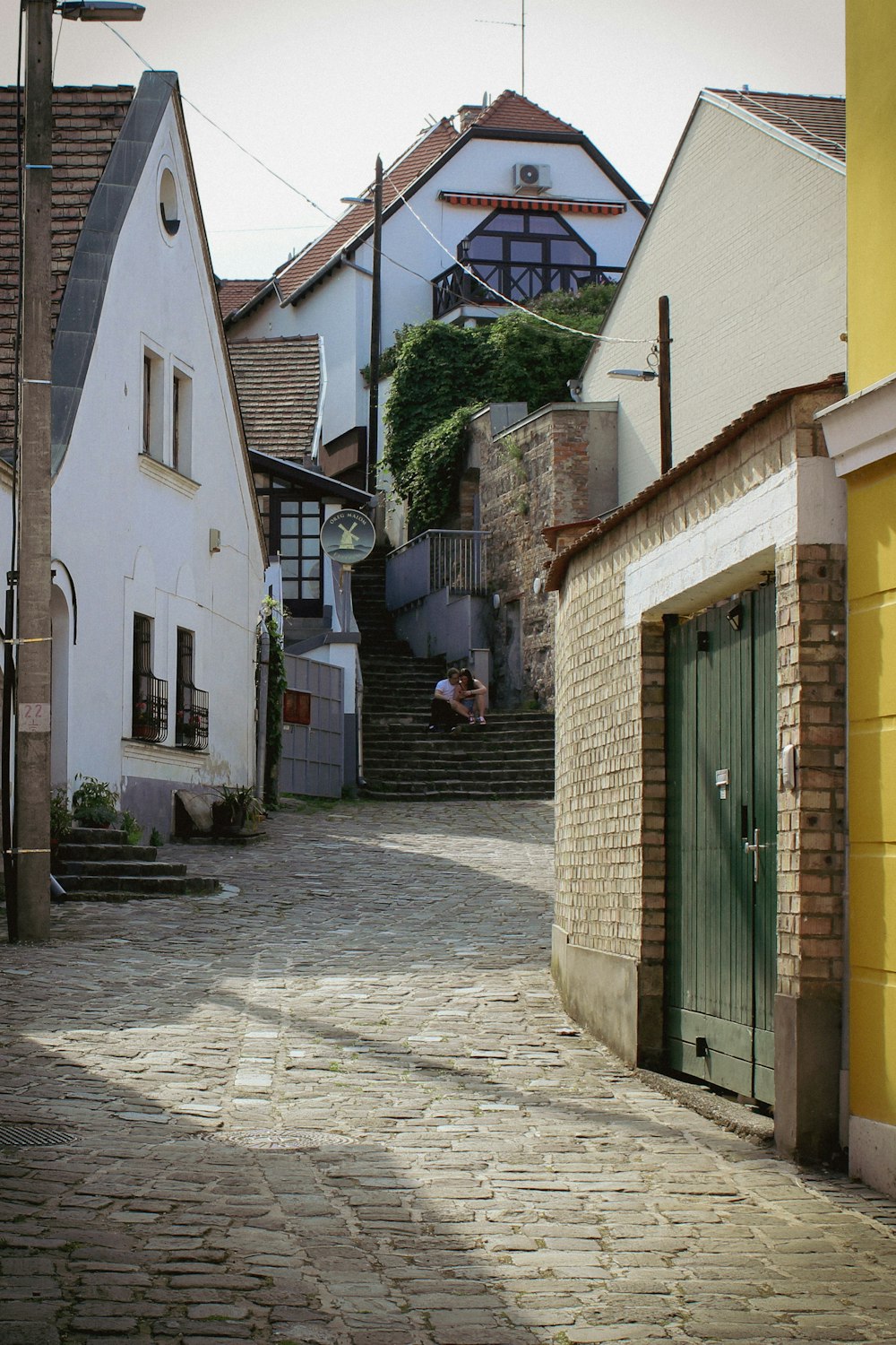 a cobblestone street in a small town