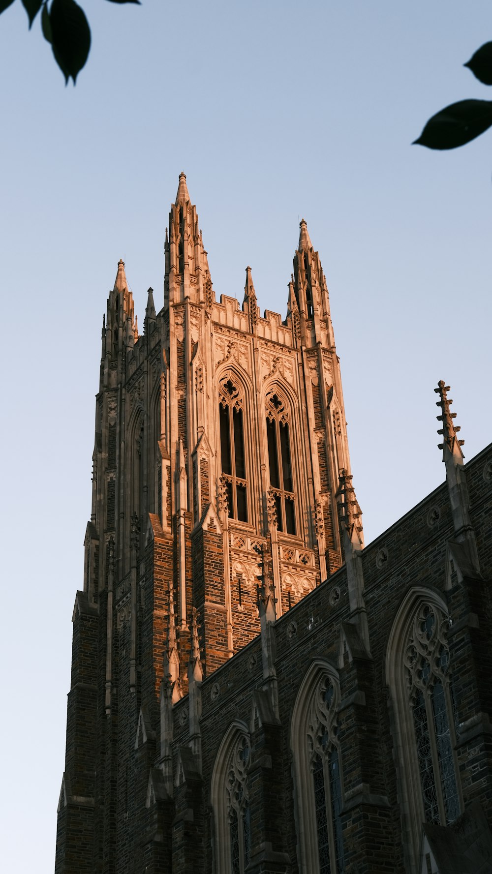 a very tall building with a clock on it's side