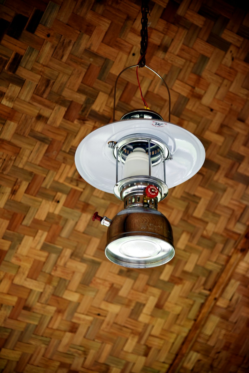 an overhead view of a light fixture on a wood floor