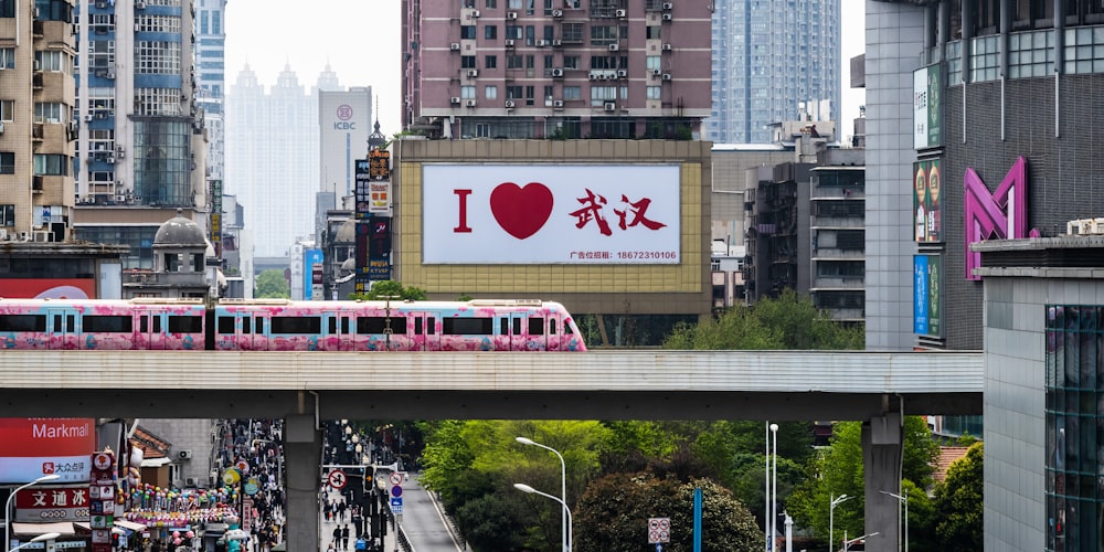 a train traveling over a bridge in a city